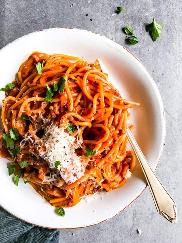 white plate with one pot spaghetti and meat sauce