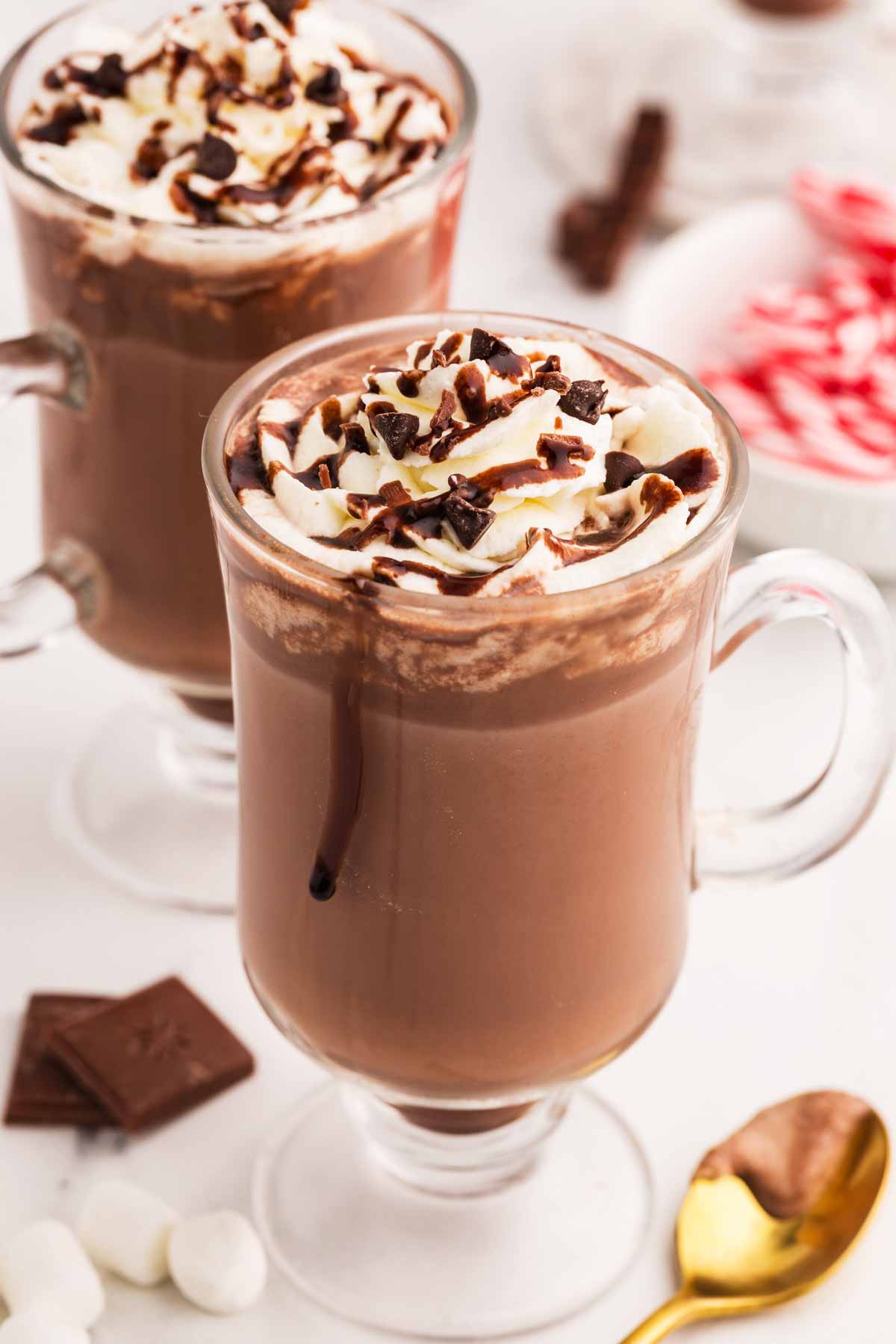 frontal view of two glass mugs of hot chocolate