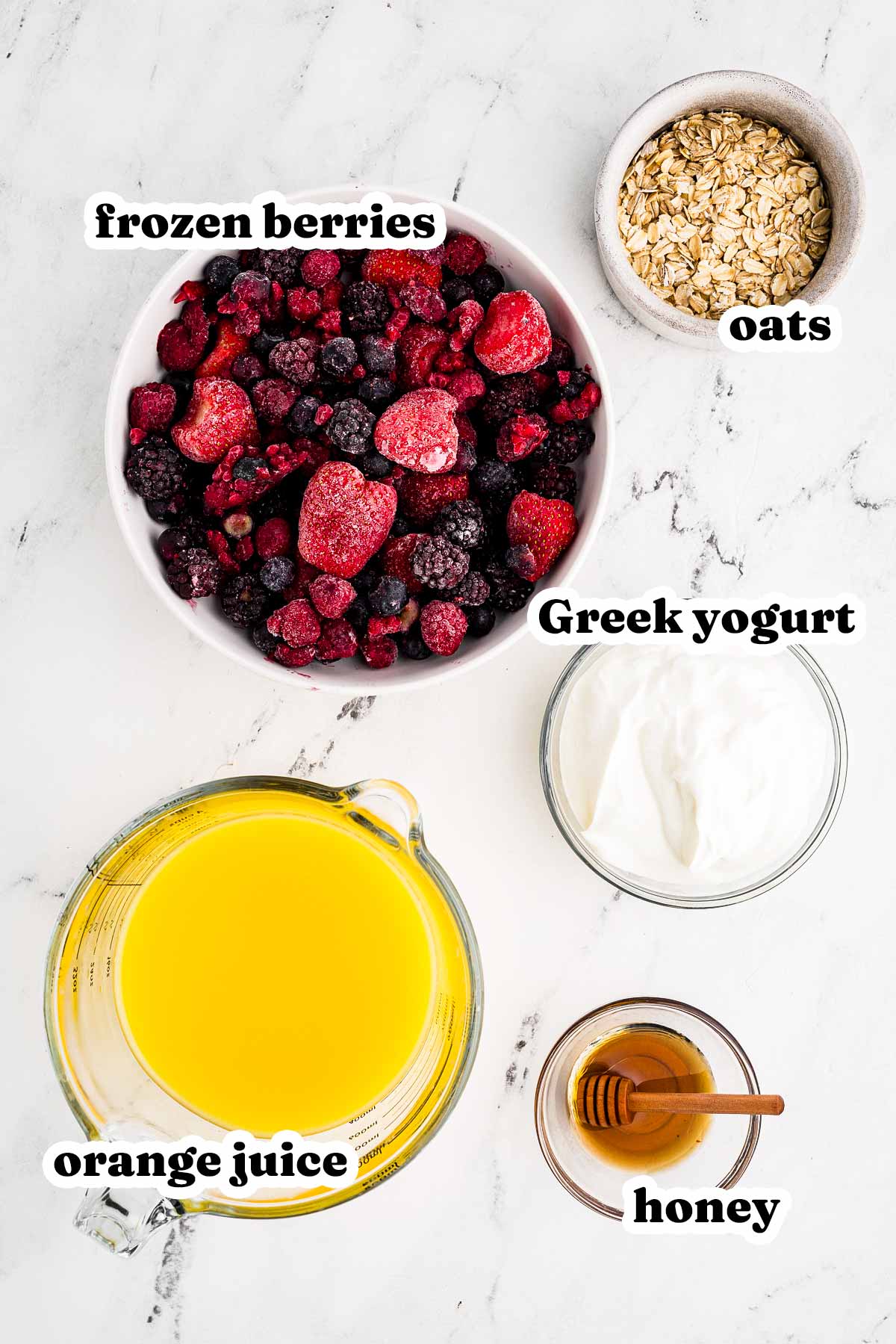 overhead view of ingredients to make mixed berry smoothie with text labels