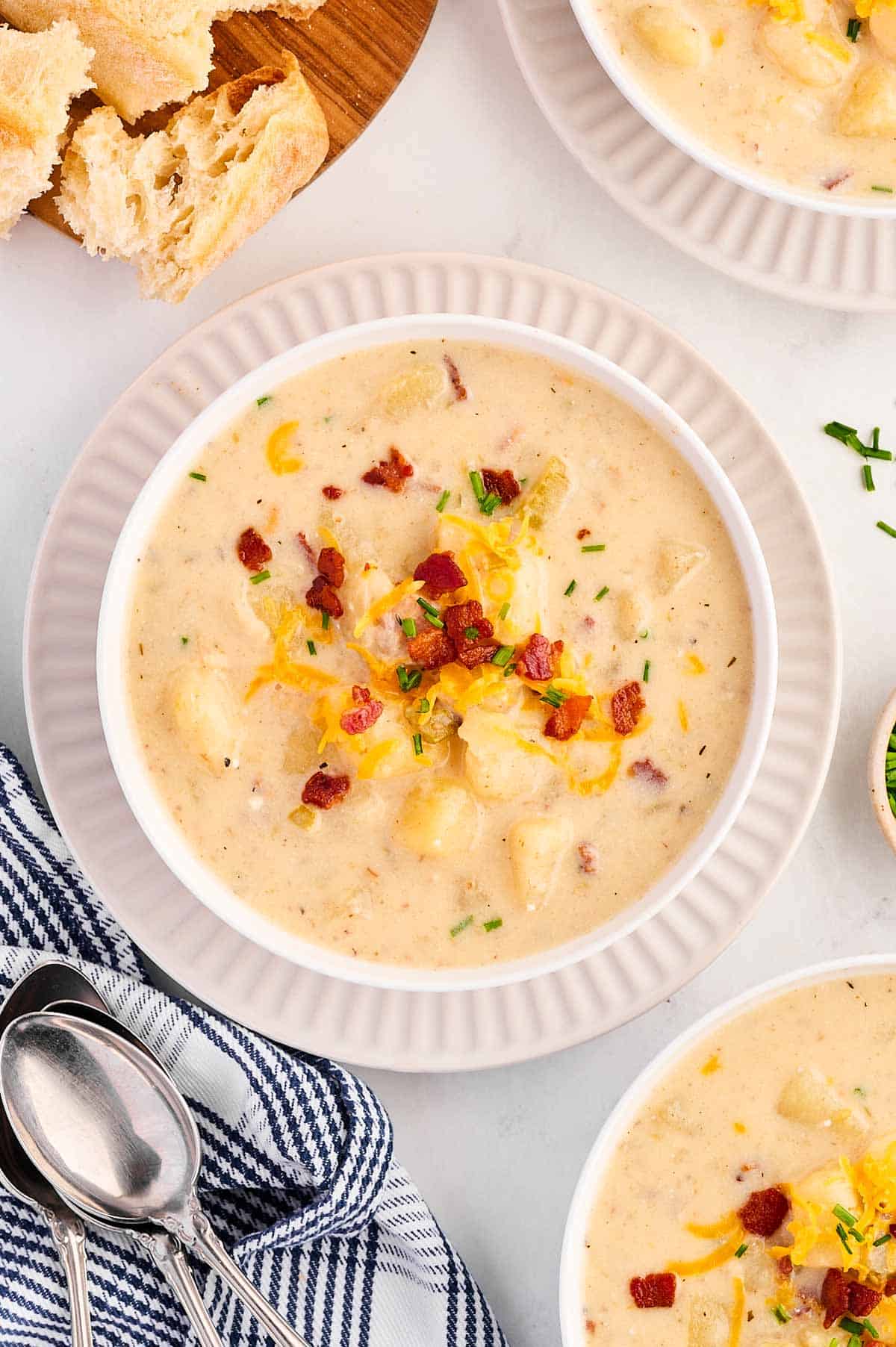 overhead view of bowl with potato soup on set table