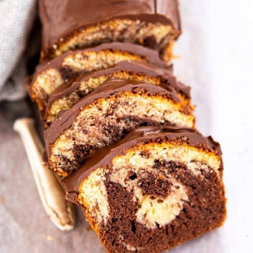 sliced marble pound cake on a wooden board