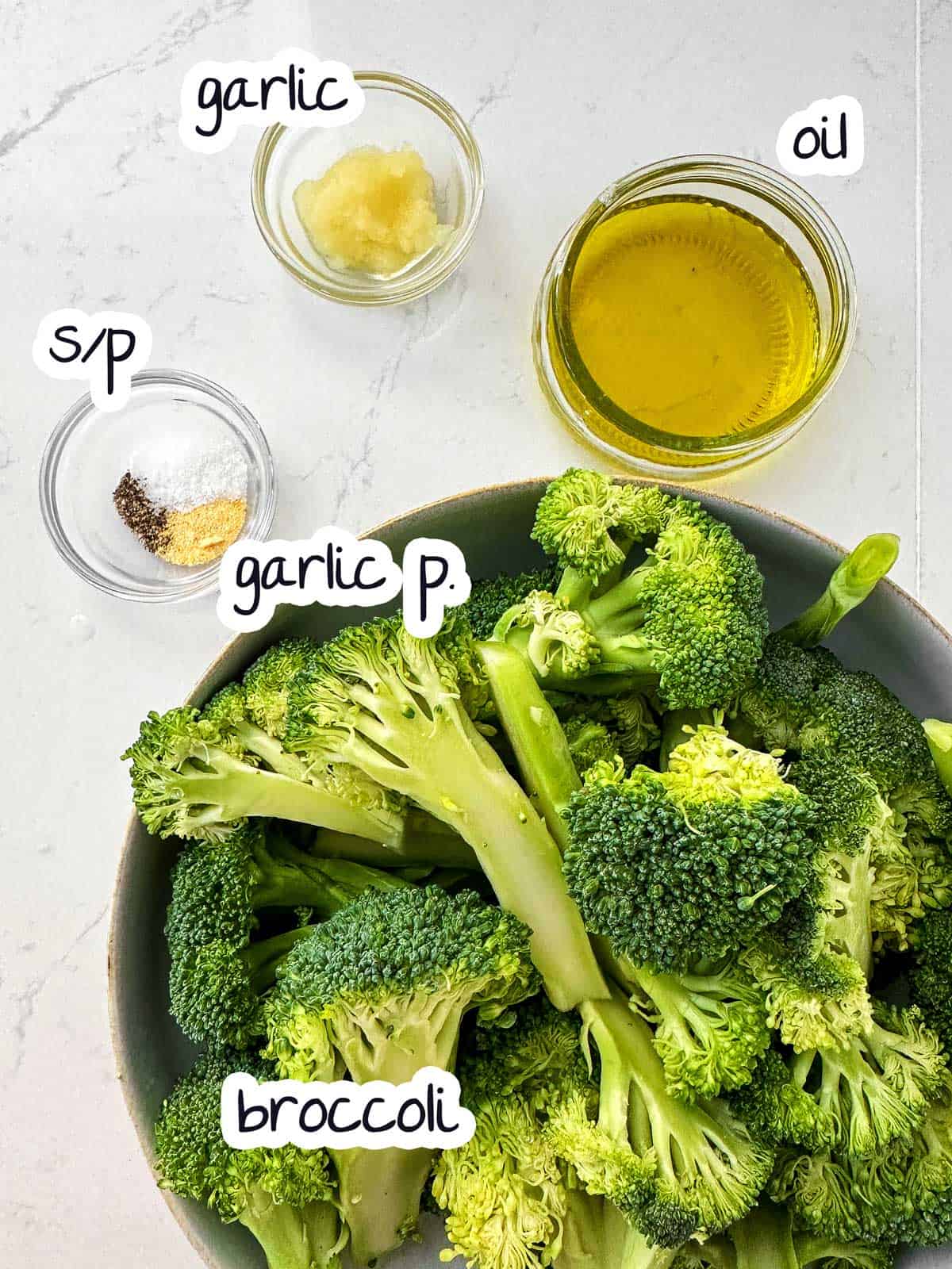 ingredients for garlic roasted broccoli with text labels