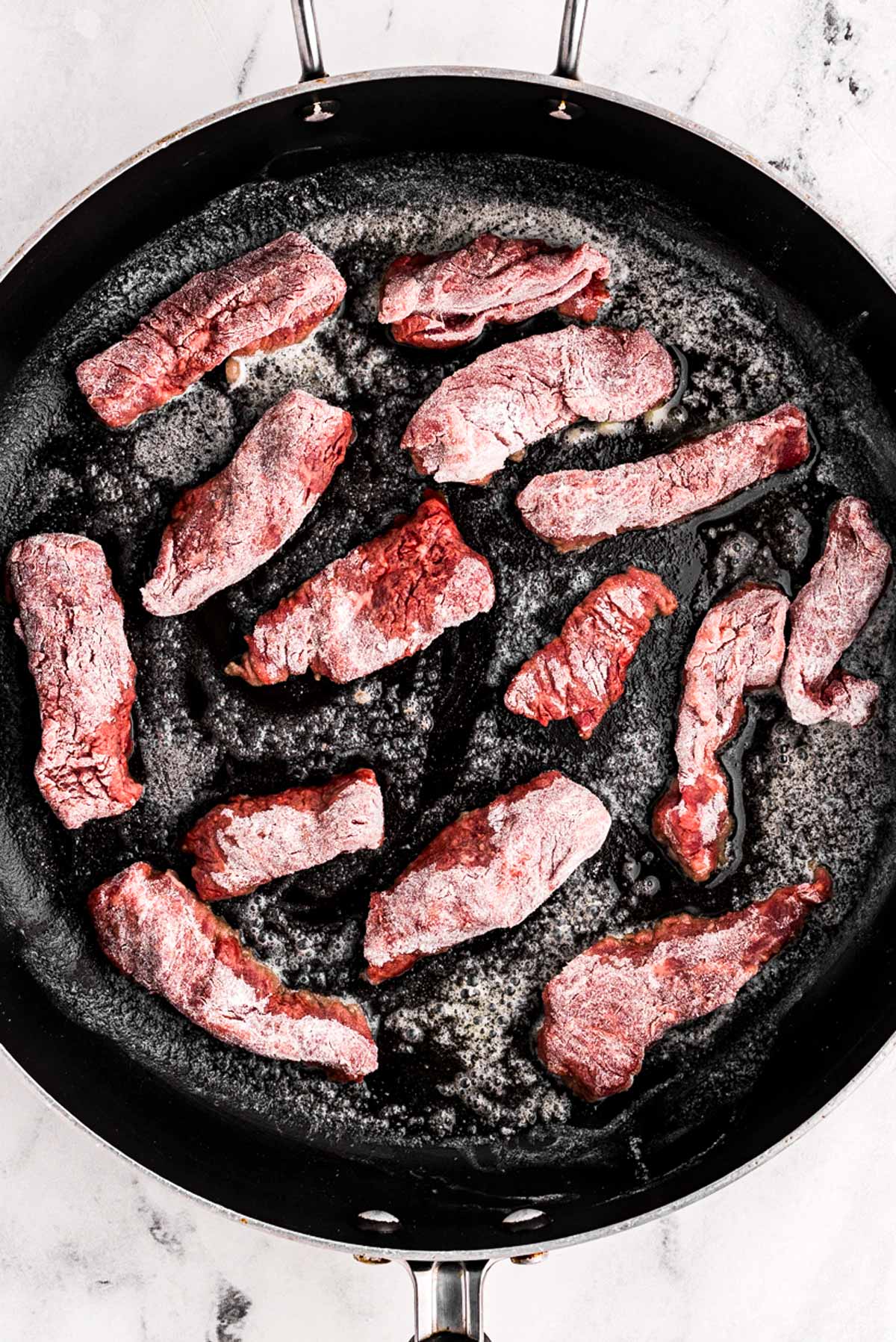 overhead view of beef in skillet