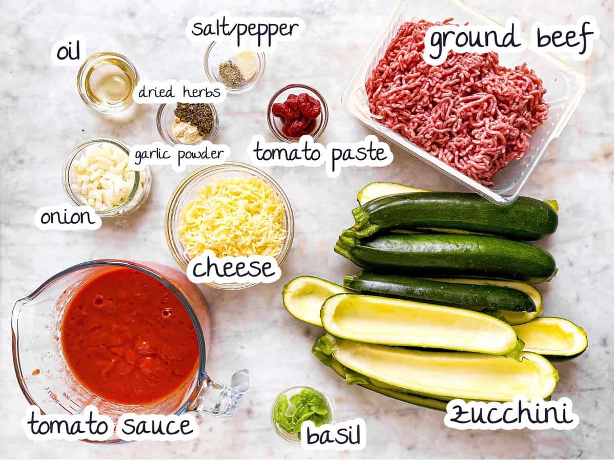 overhead view of ingredients to make zucchini boats with text labels