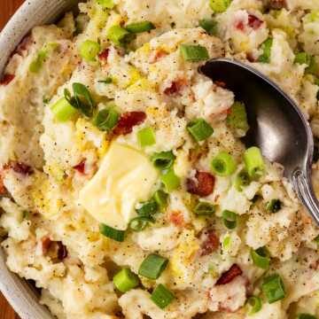 overhead view of colcannon with butter in bowl