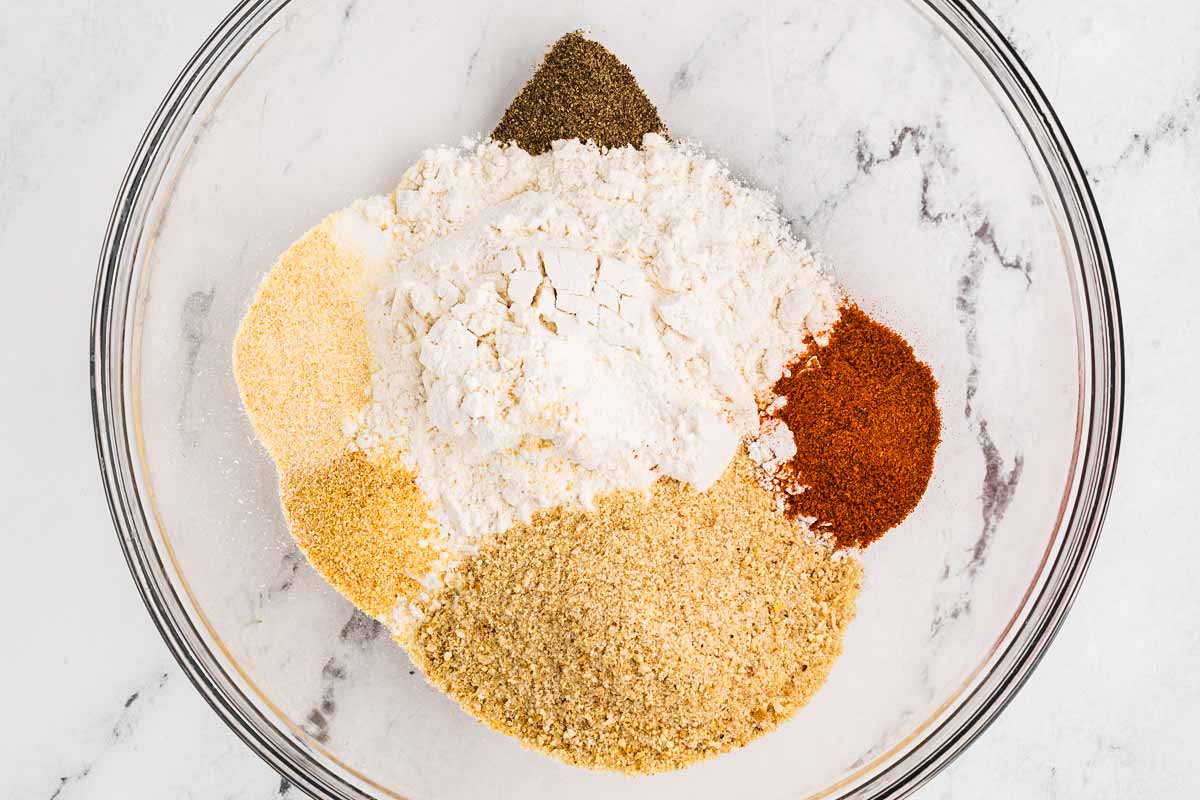 overhead view of flour and seasoning in bowl