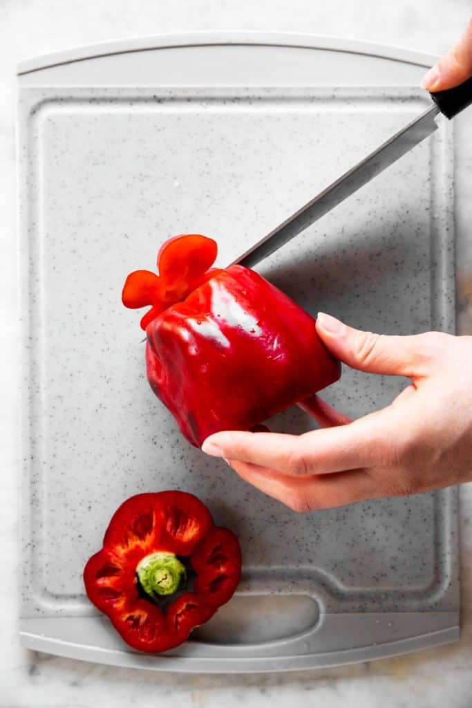 https://www.savorynothings.com/wp-content/uploads/2021/04/how-to-cut-a-bell-pepper-image-step-2-683x1024.jpg