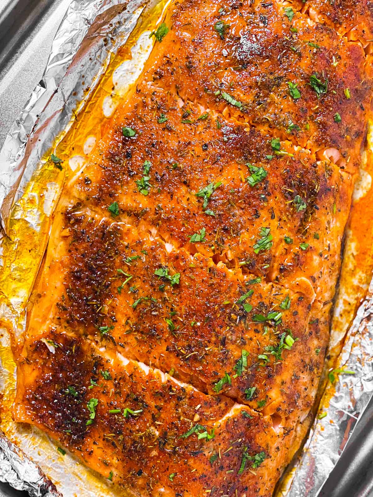 Capri - Enjoy oven baked salmon topped with garlic butter