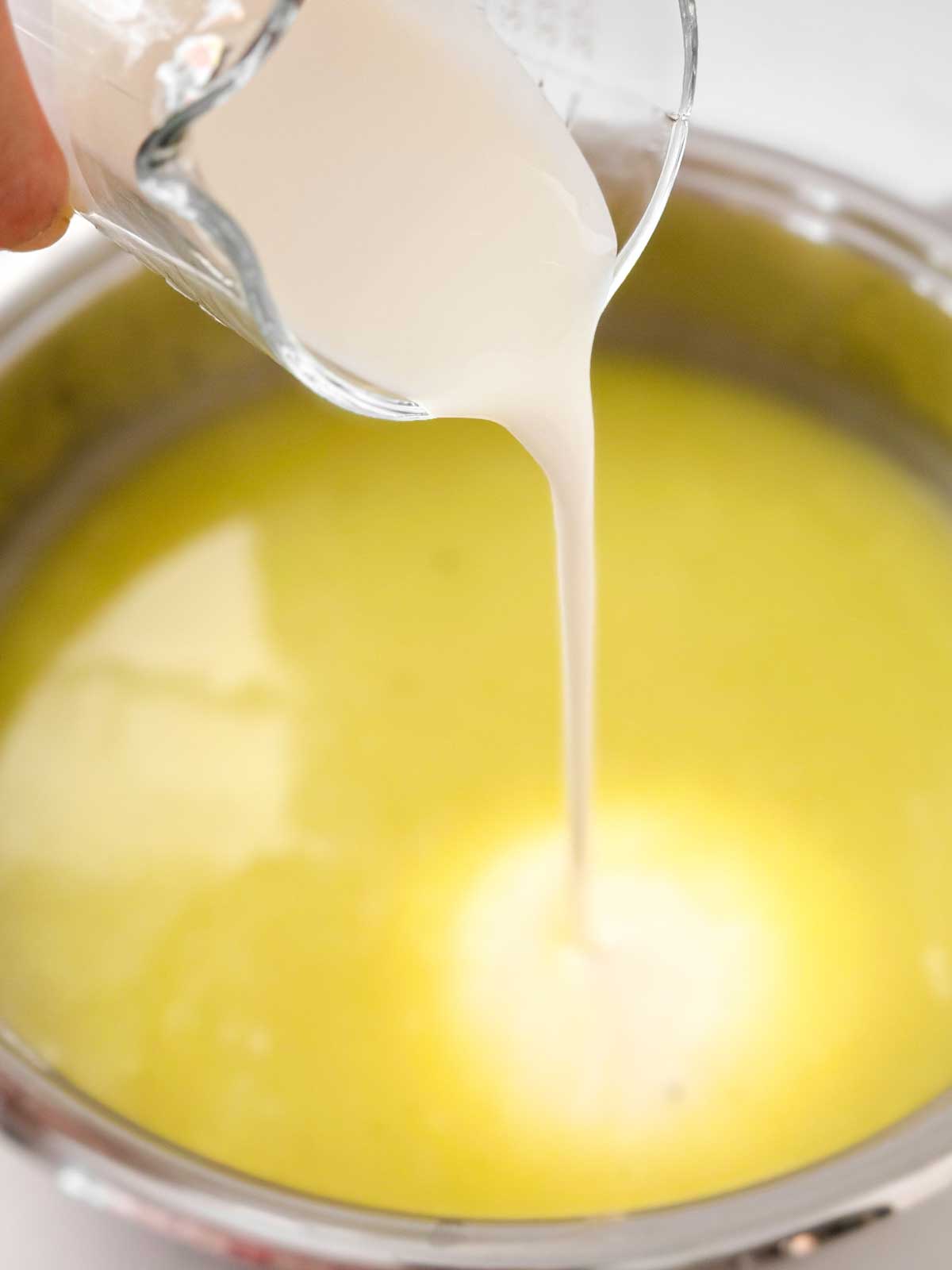 cream pouring into sauce