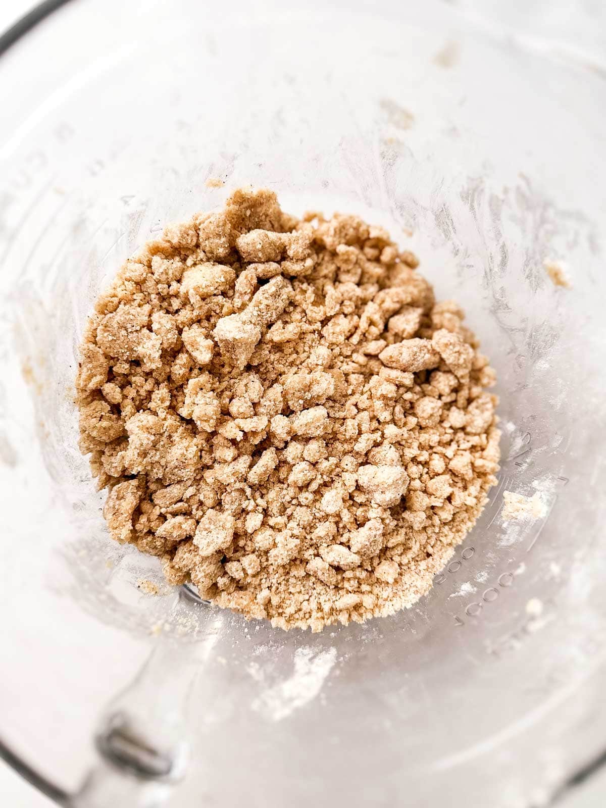 overhead view of crumb mixture in glass bowl