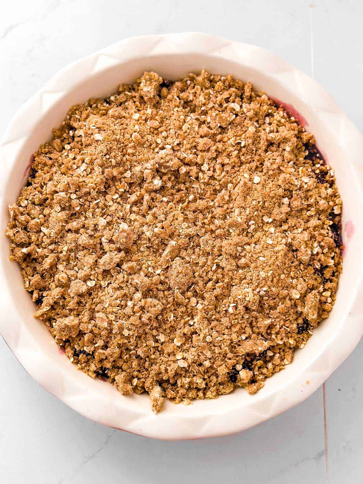 overhead view of unbaked cherry crisp