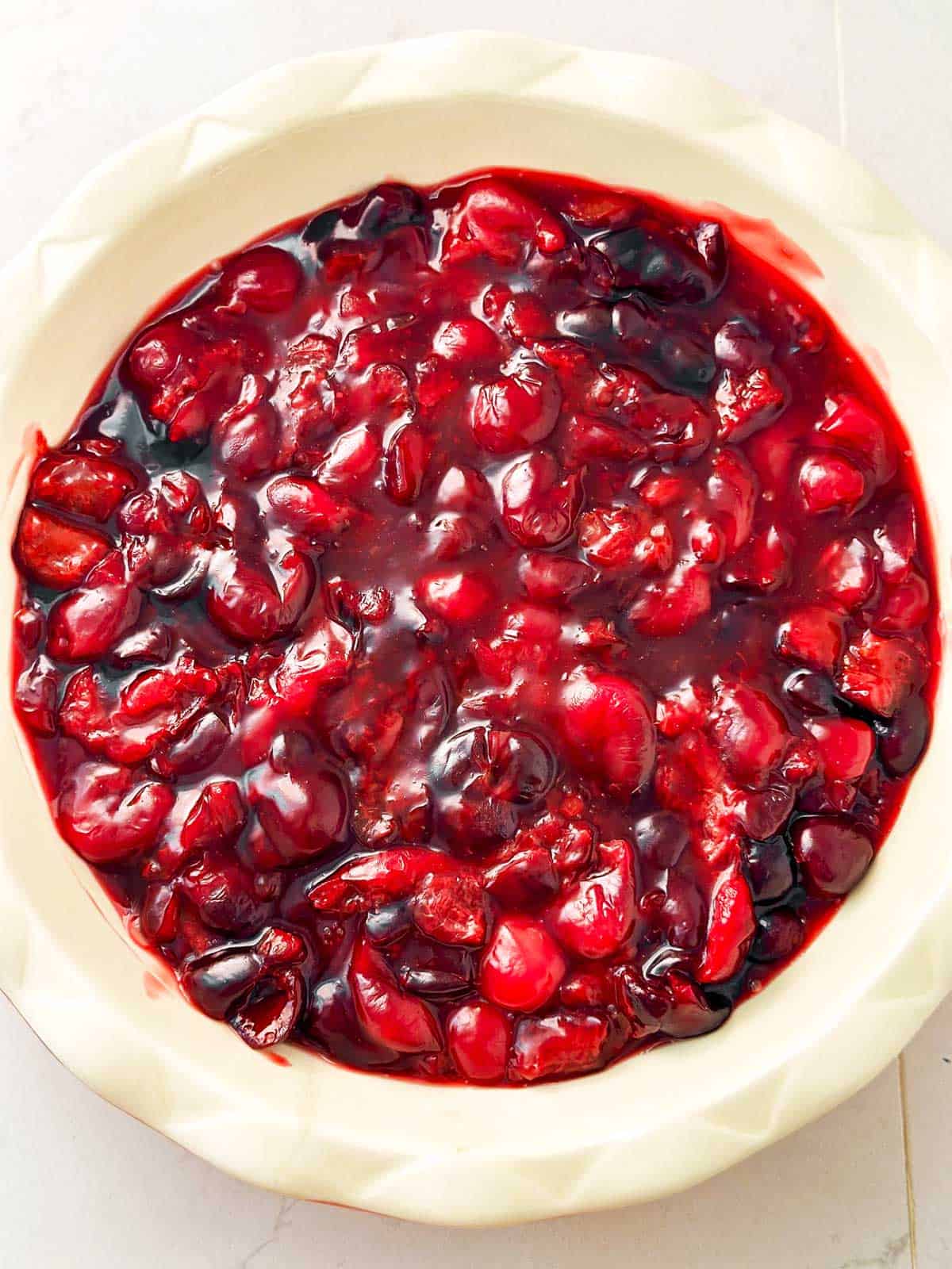 overhead view of cherry filling in round pie dish