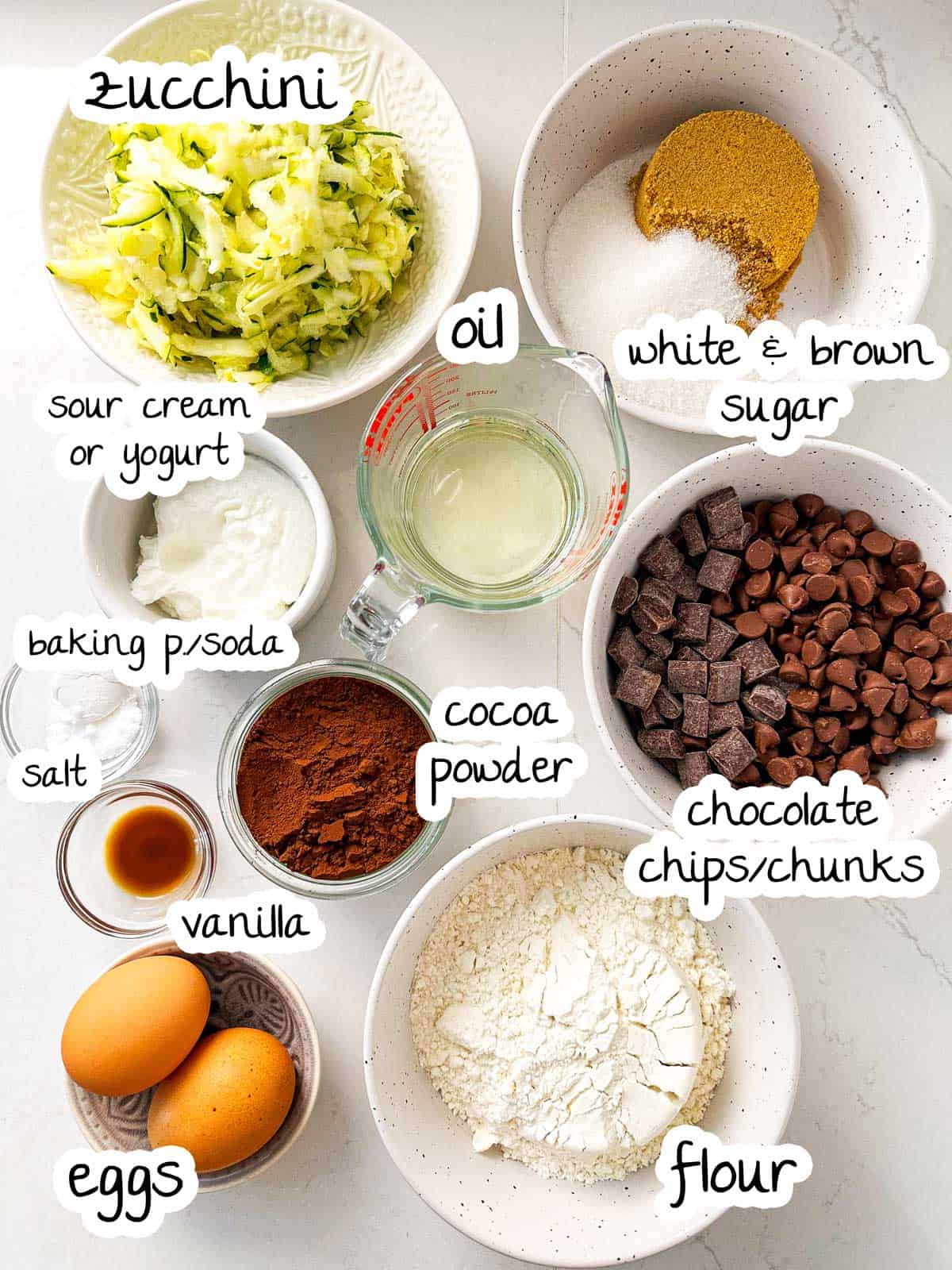 overhead view of ingredients for chocolate zucchini bread with text labels