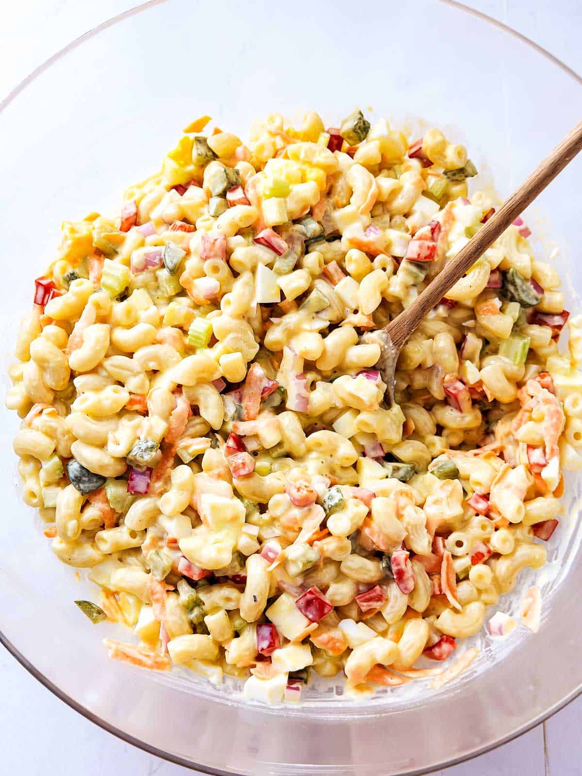 overhead view of macaroni salad in glass bowl