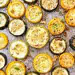 overhead close up view of roasted summer squash and zucchini on sheet pan
