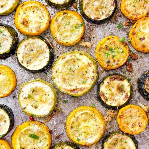overhead close up view of roasted summer squash and zucchini on sheet pan