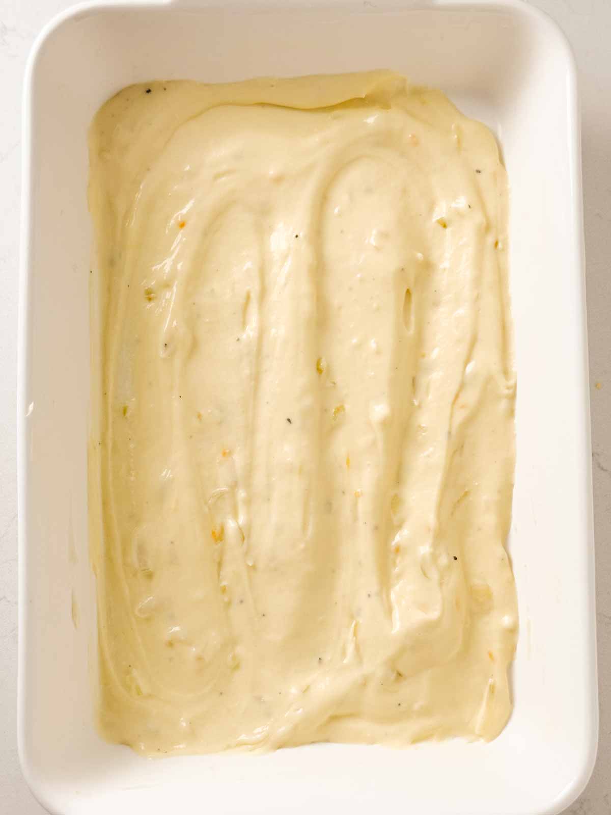 overhead view of cheese cause in white casserole dish