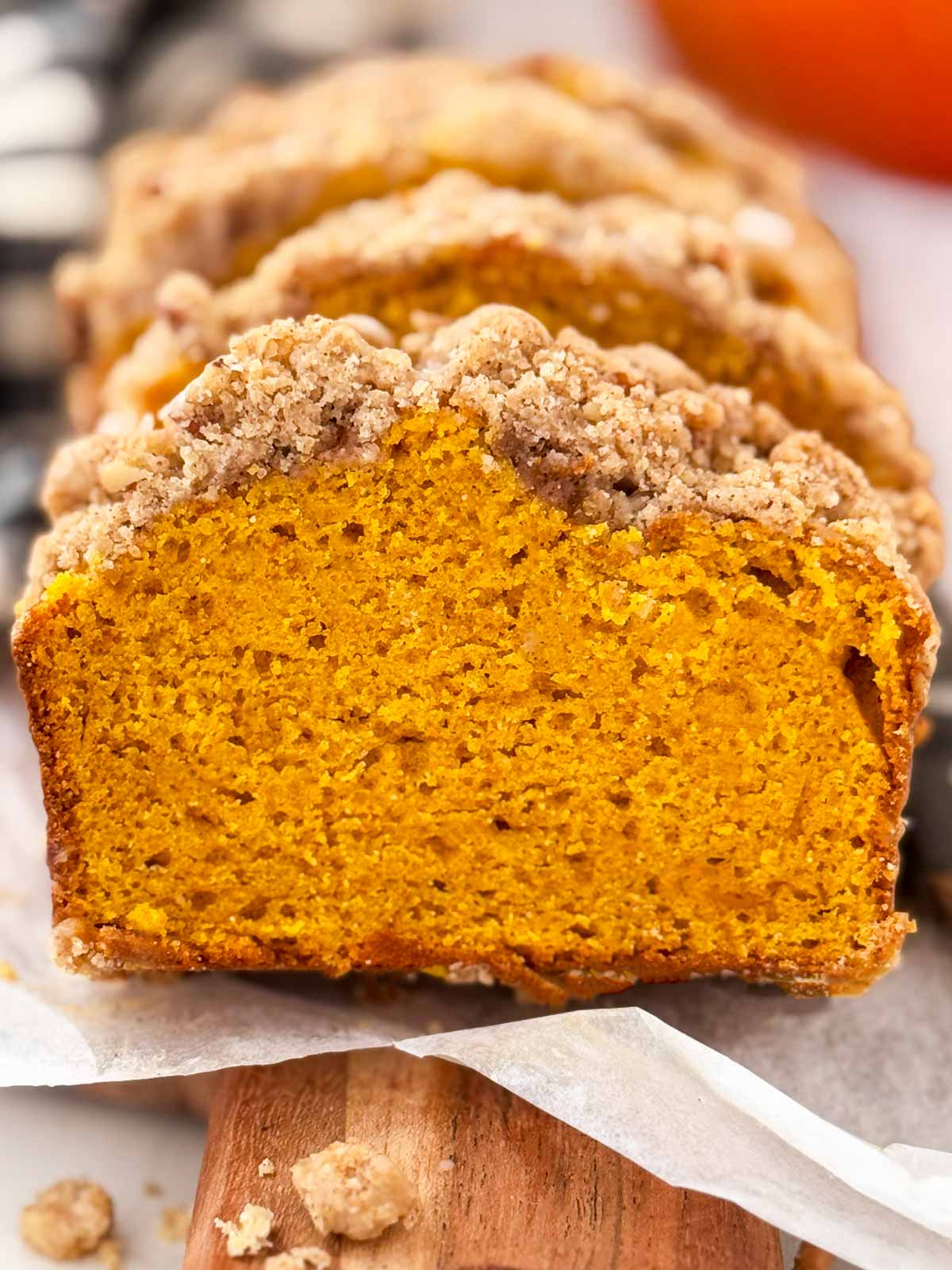 frontal view of sliced pumpkin bread with streusel