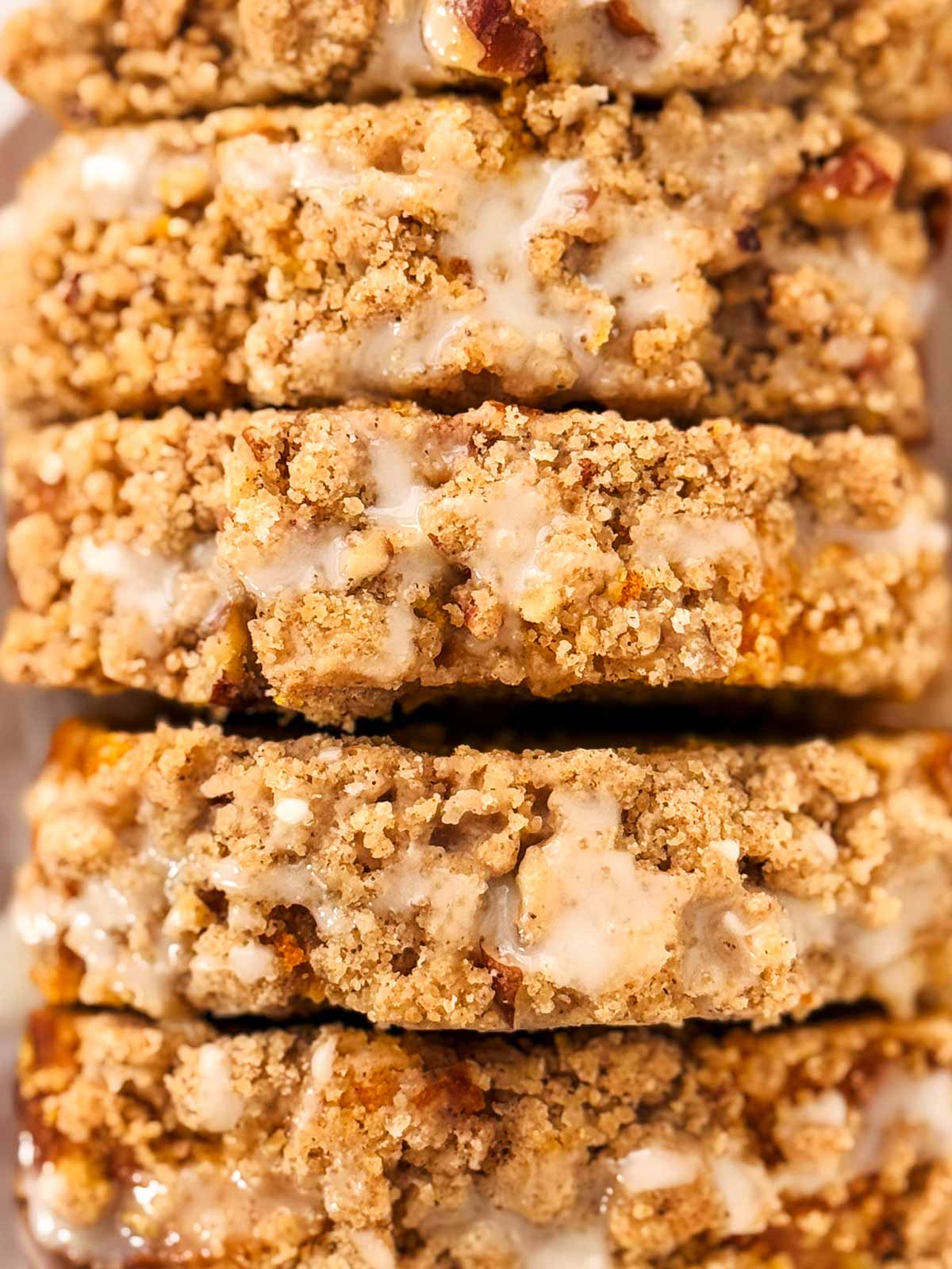 overhead close up view of streusel topping on sliced pumpkin bread