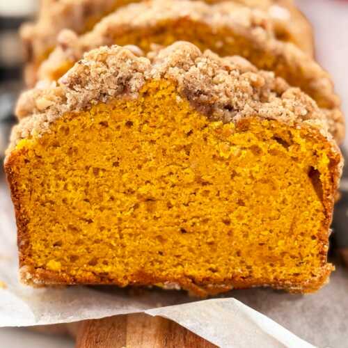 frontal view of sliced pumpkin bread with streusel