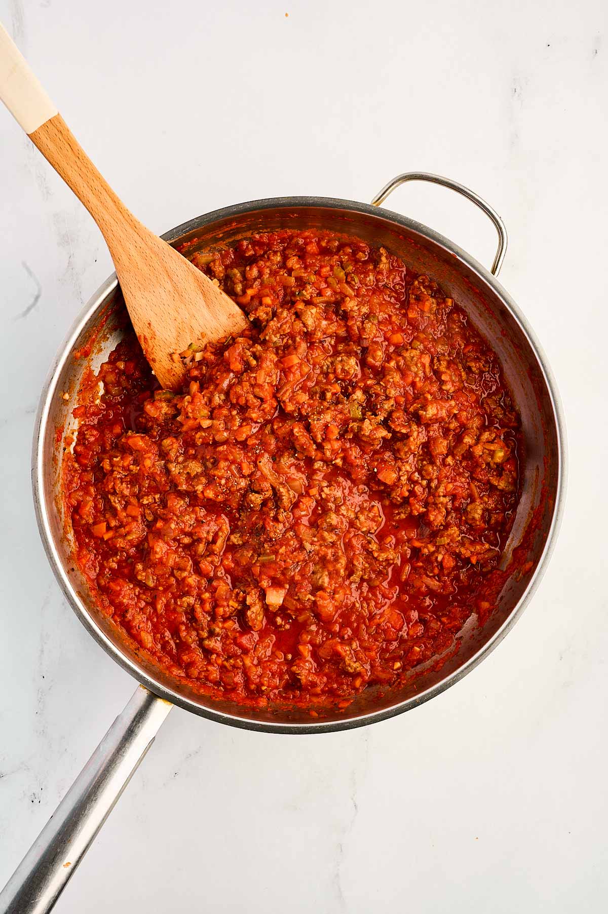 overhead view of sausage tomato sauce in skillet