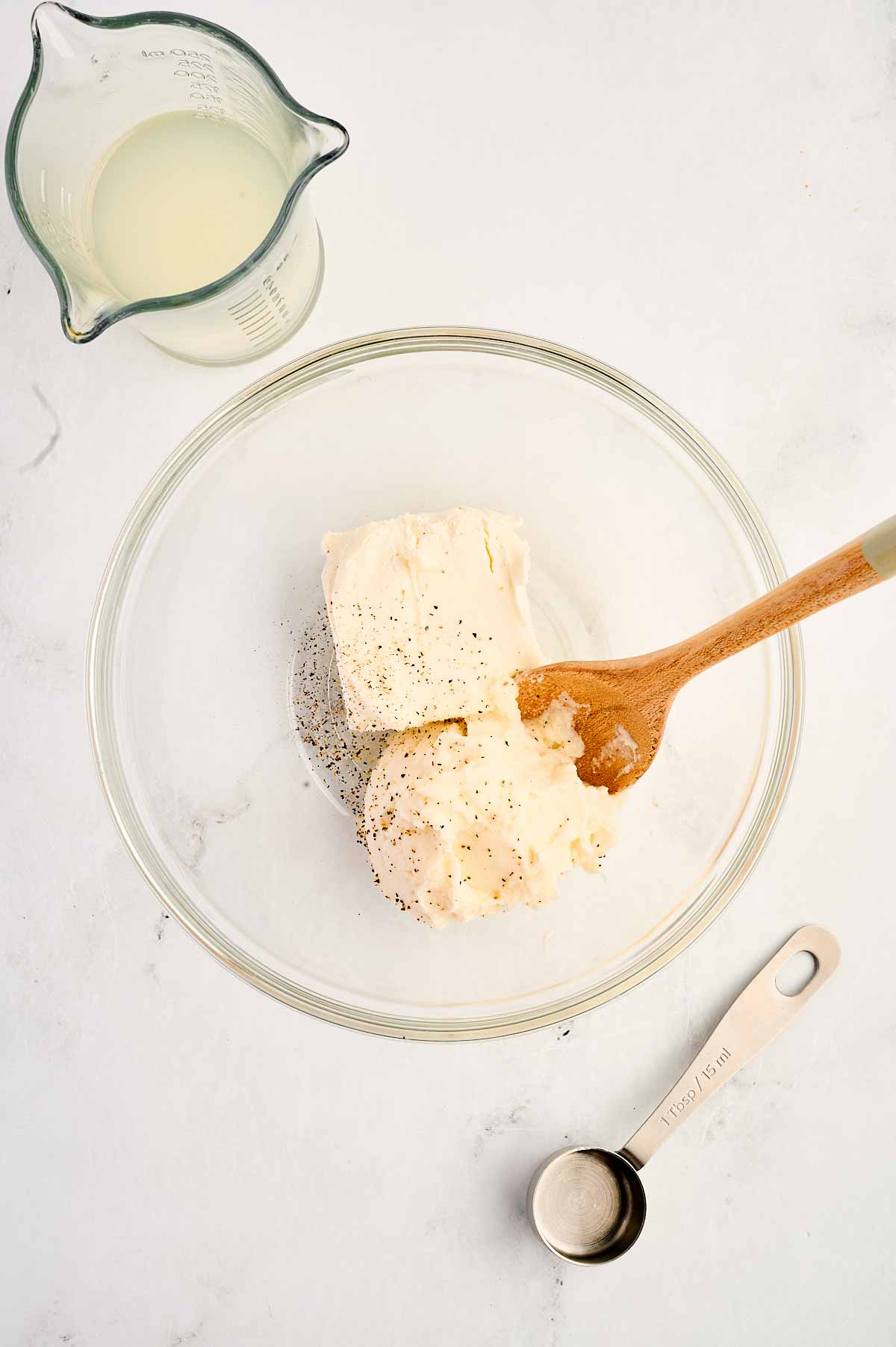 overhead view of ricotta and cream cheese in small bowl