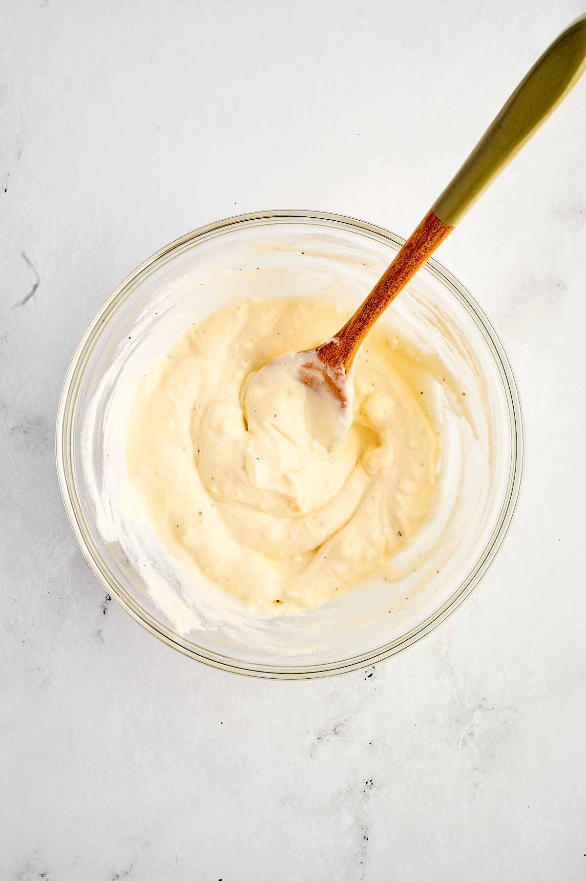 overhead view of cream sauce in small bowl