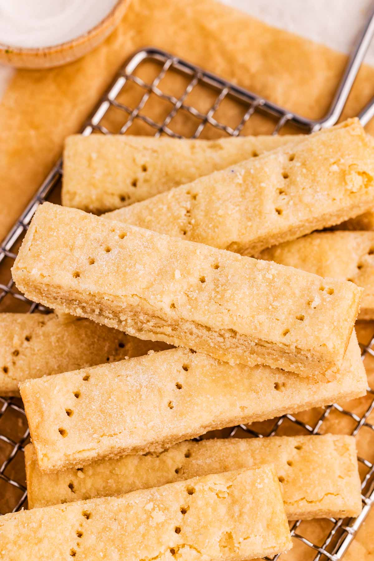 frontal view of shortbread cookie fingers on cooling rack