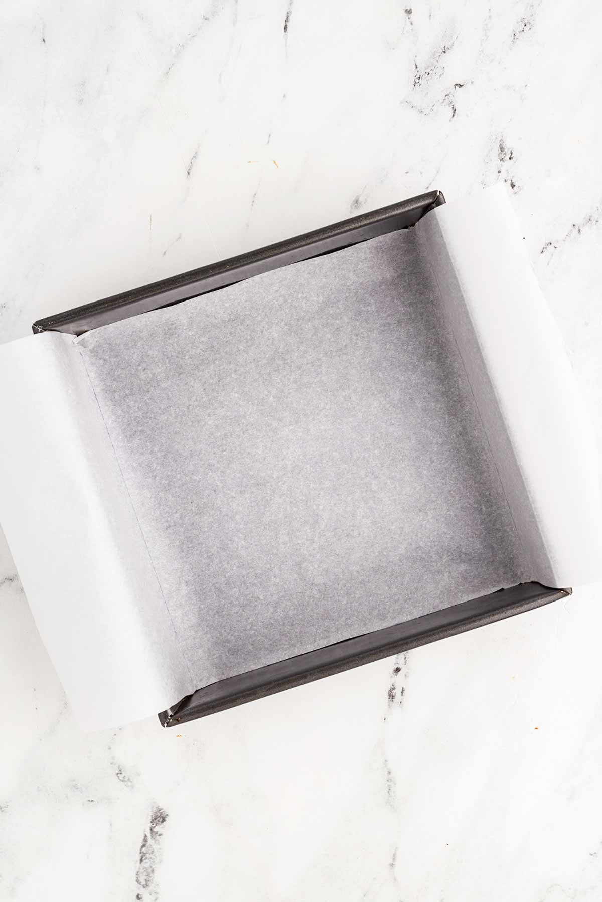 overhead view of lined square baking pan