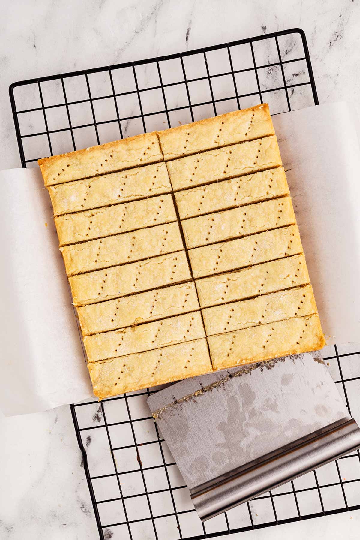 overhead view of cut shortbread cookies on wire rack