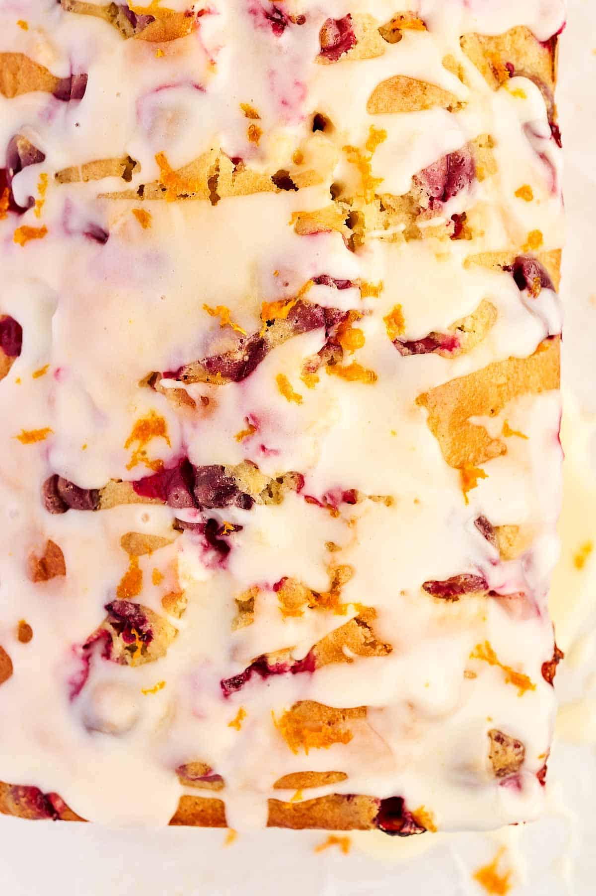 overhead close up view of glazed cranberry orange bread