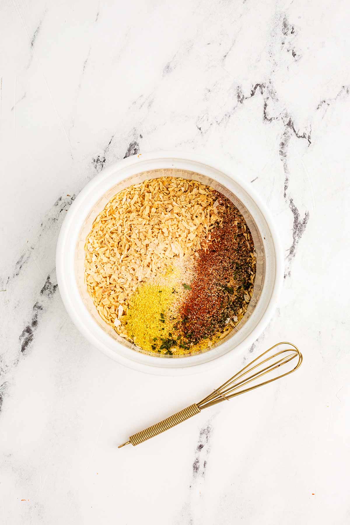 overhead view of homemade onion soup mix in small white bowl