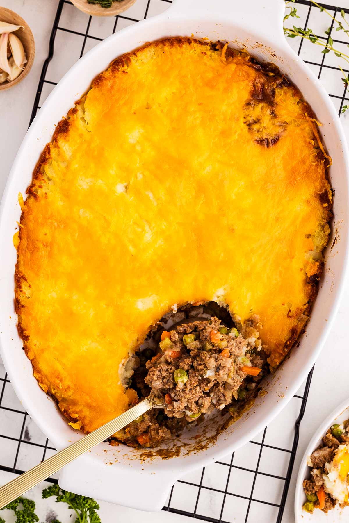 overhead view of baked shepherd’s pie with a scoop taken out