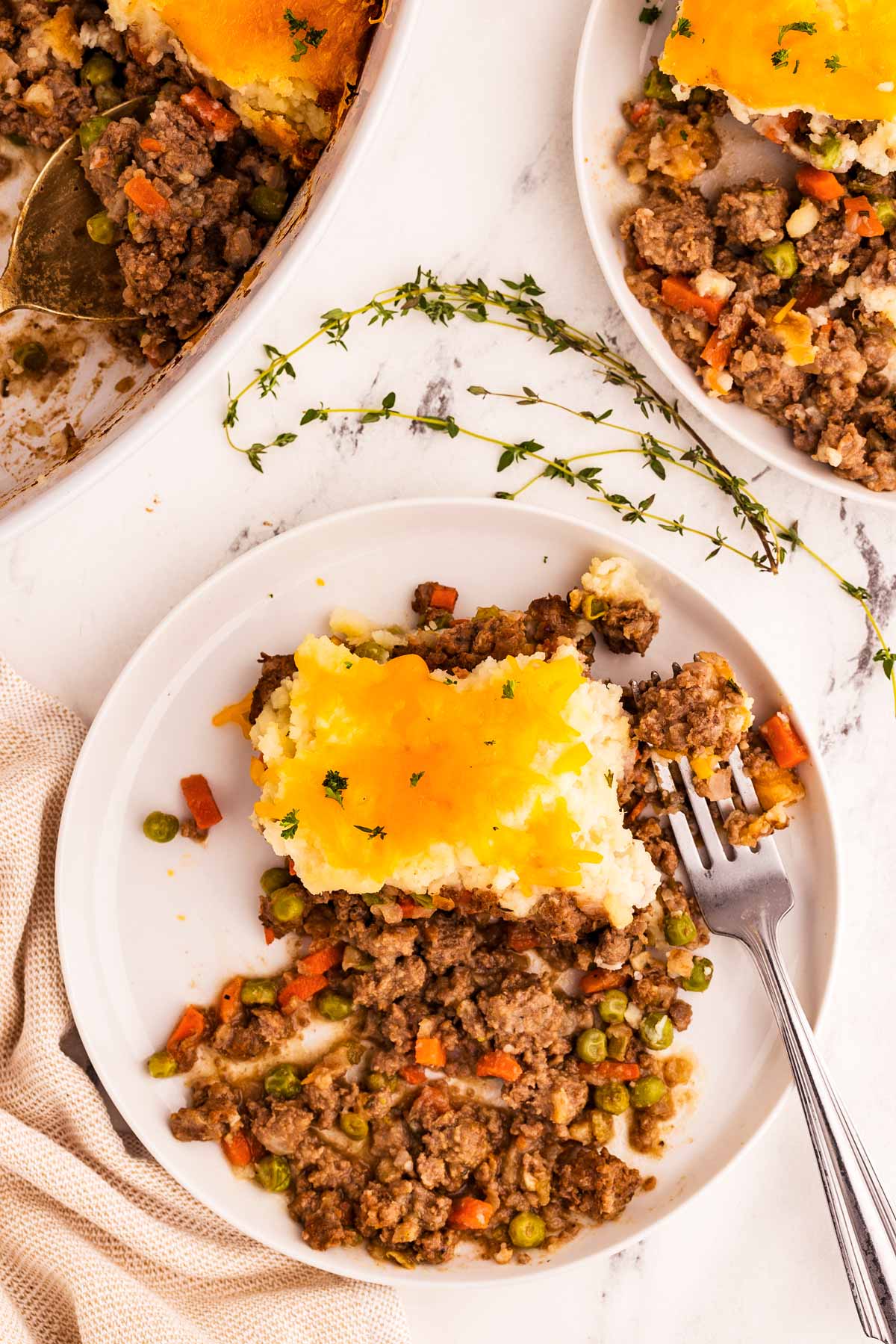 overhead view of white plate filled with shepherds pie