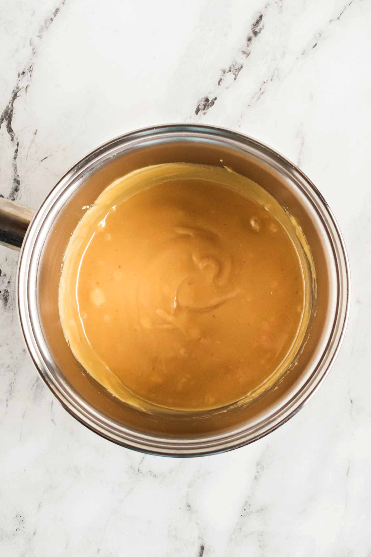 overhead view of caramel in small saucepan