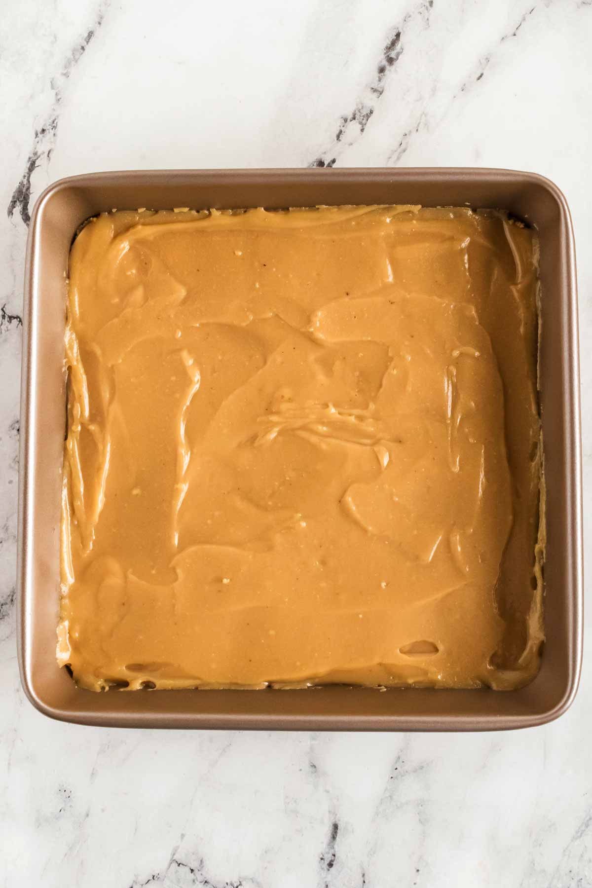 overhead view of caramel in baking pan