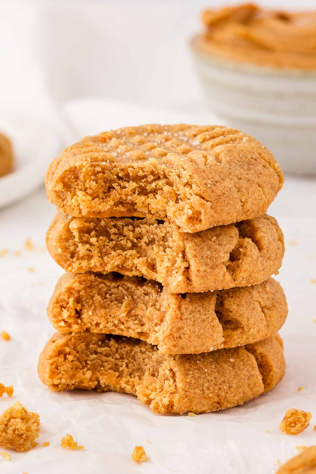 frontal view of stacked peanut butter cookies with bites taken out of each