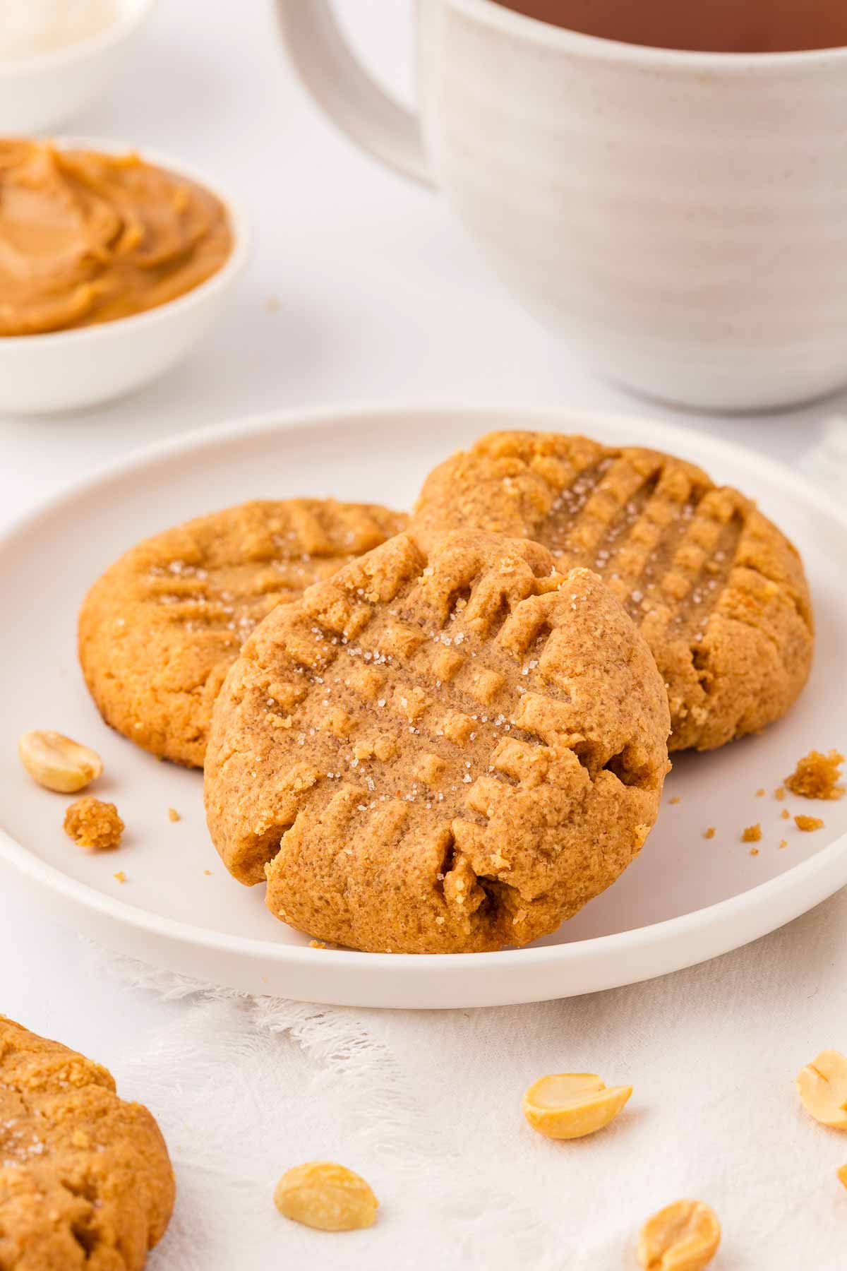 frontal view of peanut butter cookies on white plate