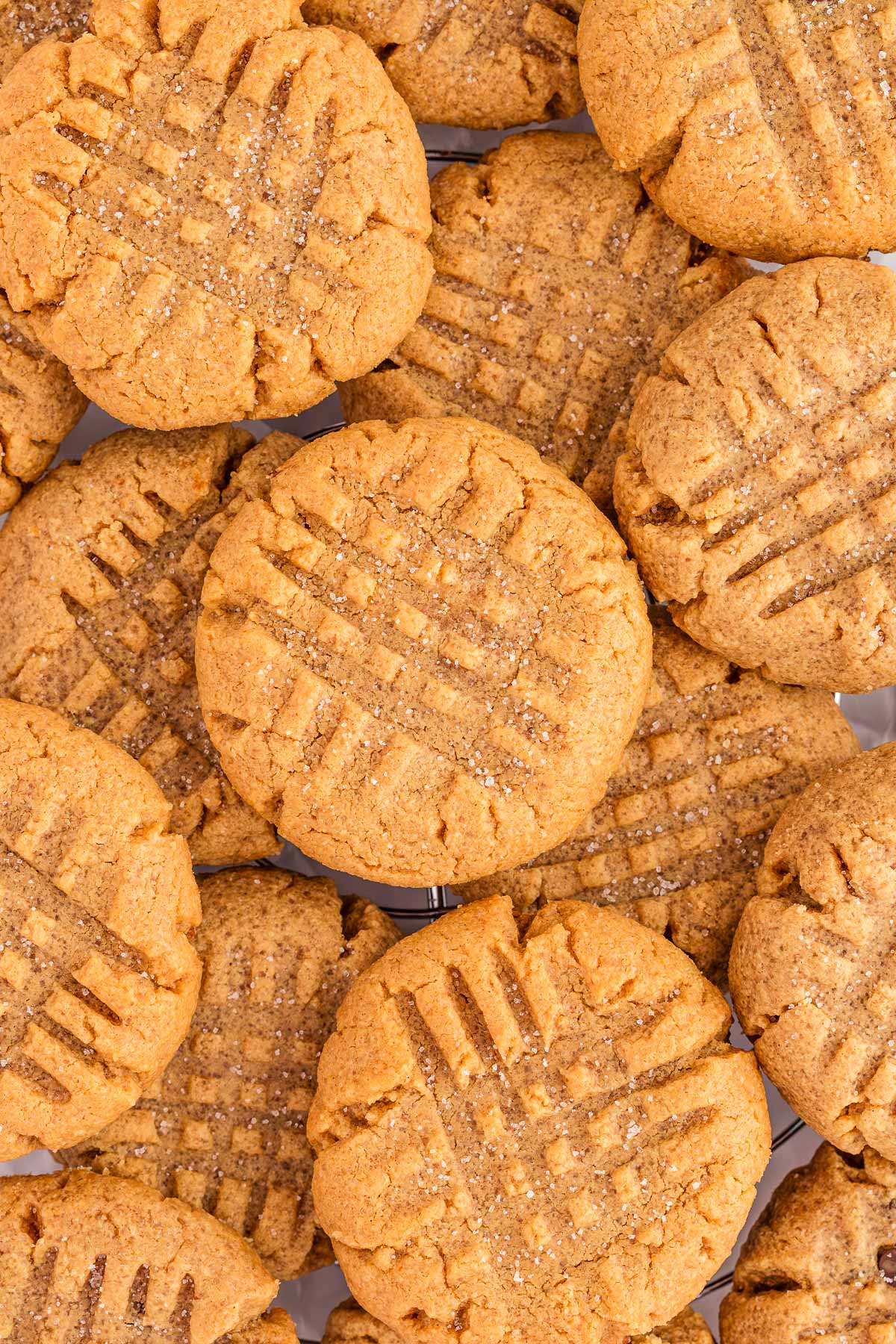 overhead close up view of piled peanut butter cookies