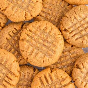 overhead close up view of piled peanut butter cookies