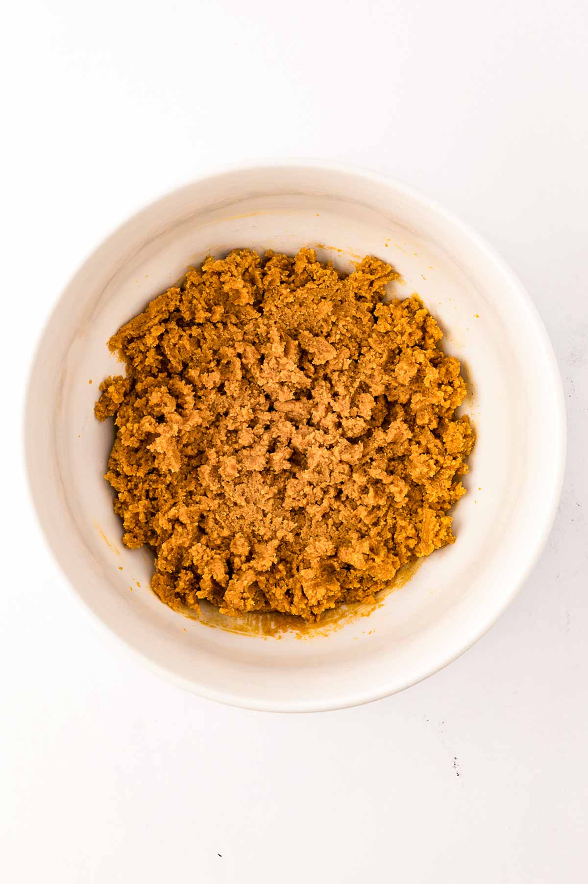 overhead view of peanut butter cookie dough in white bowl