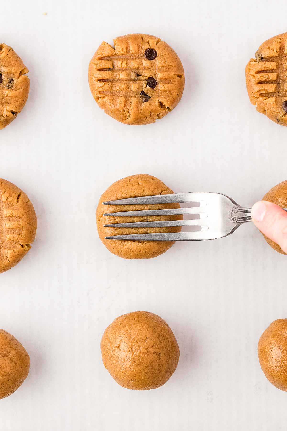 fork pressing down on peanut butter cookie