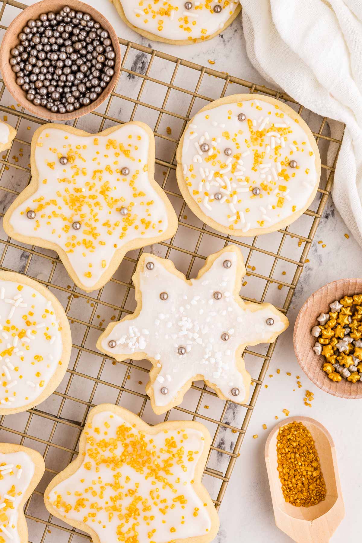 overhead view of decorated sugar cookies on wire rack