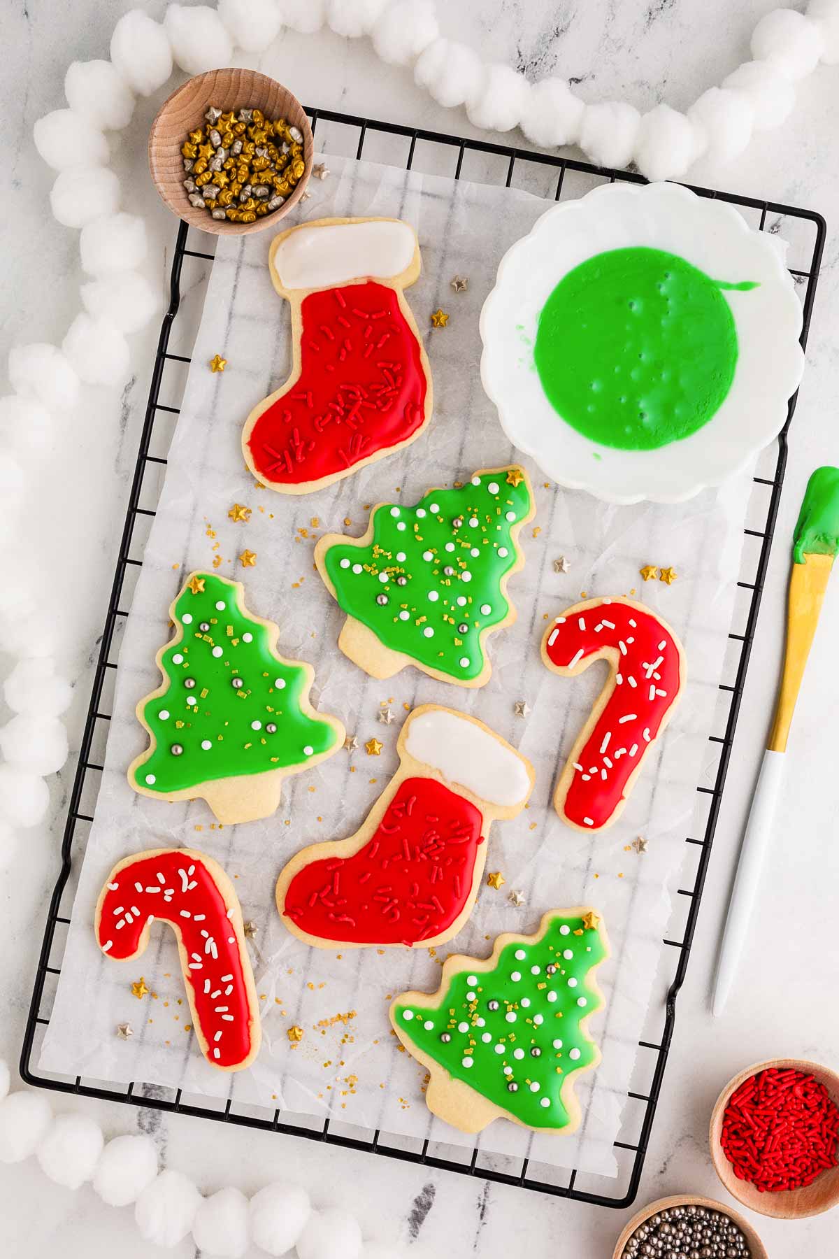 overhead view of Christmas decorated sugar cookies on wire rack