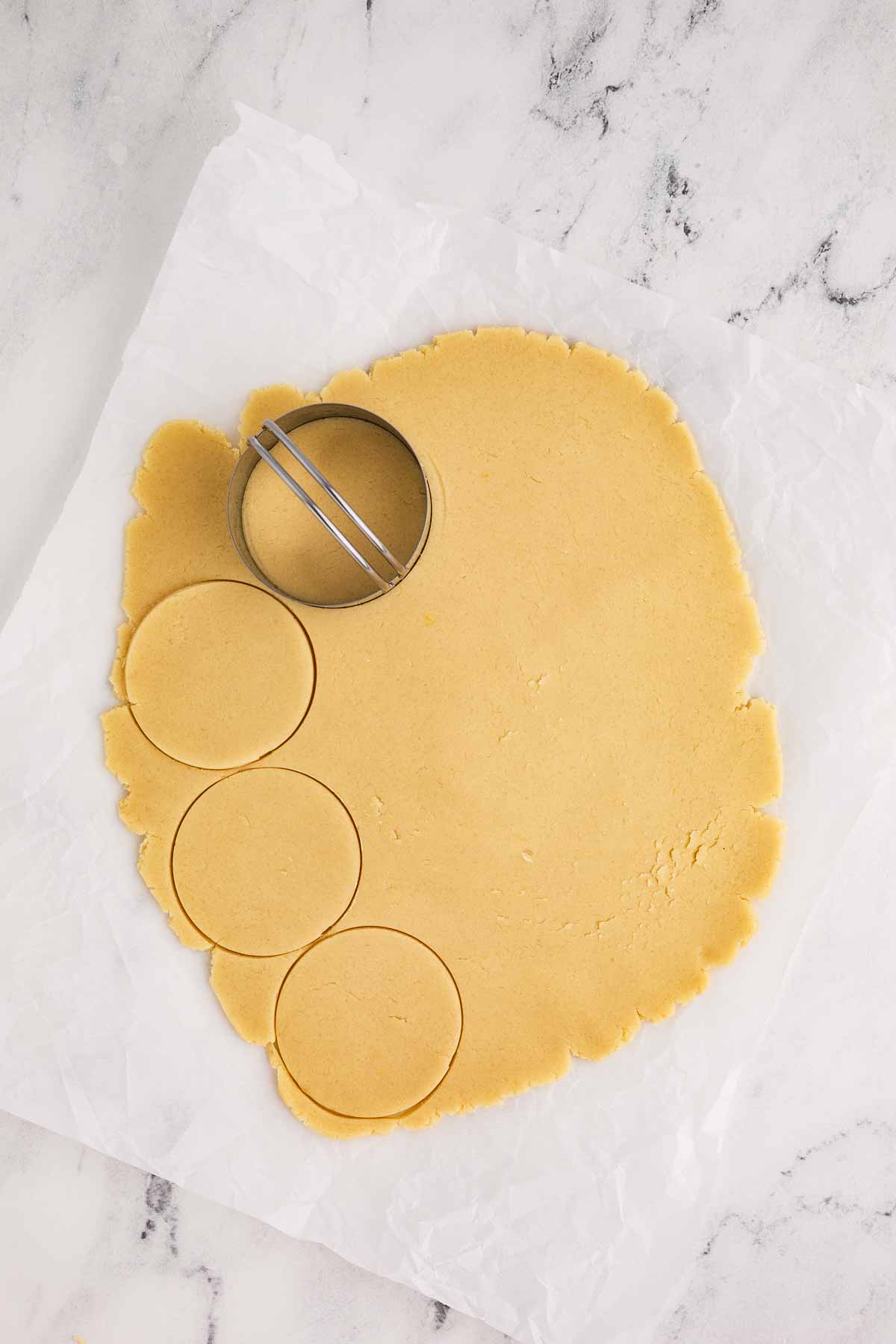 overhead view of sugar cookie dough with circle cutter