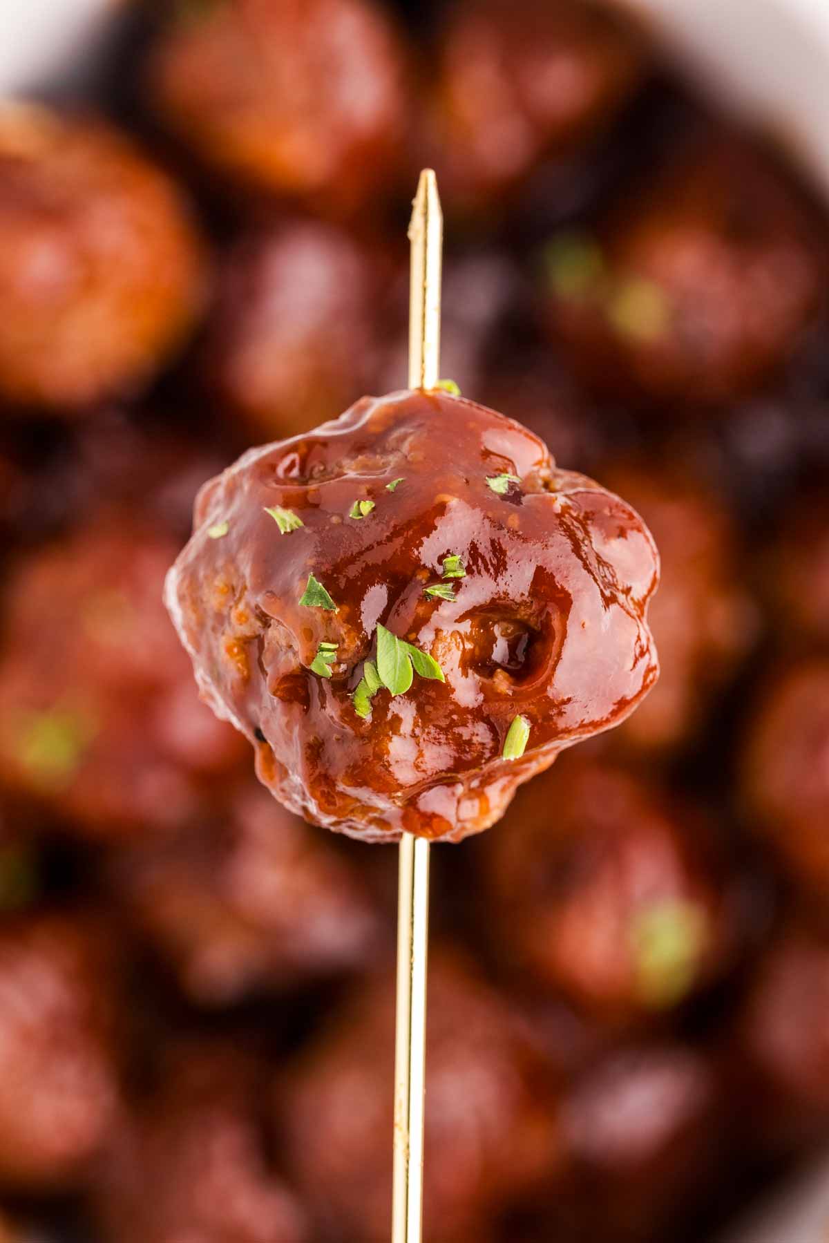 close up view of bbq meatball on toothpick