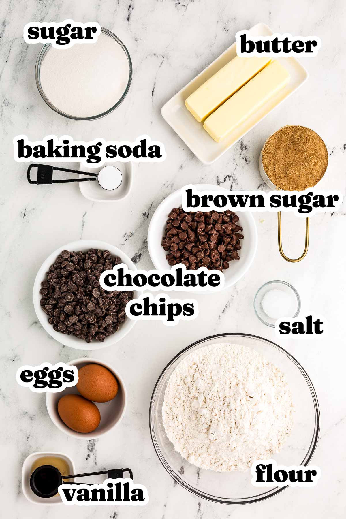 overhead view of chocolate chip cookie ingredients with text labels