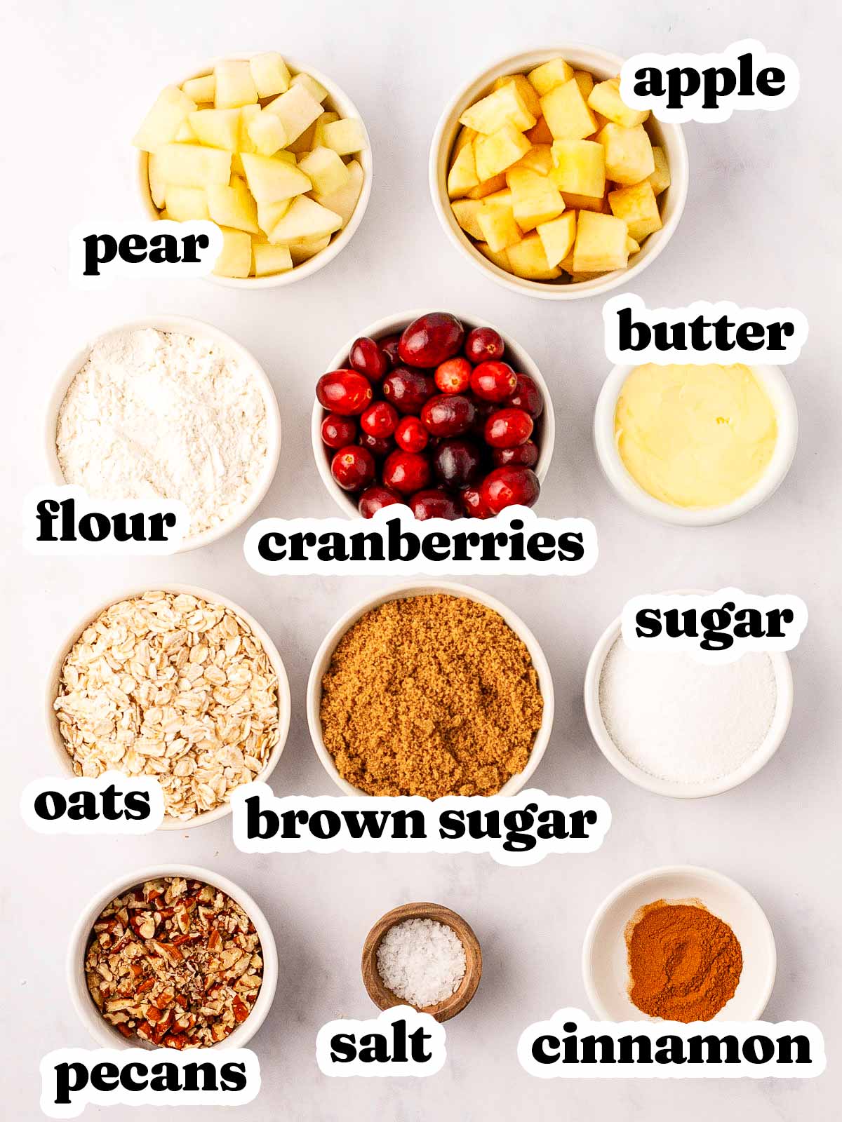 overhead view of ingredient for cranberry apple crisp with text labels