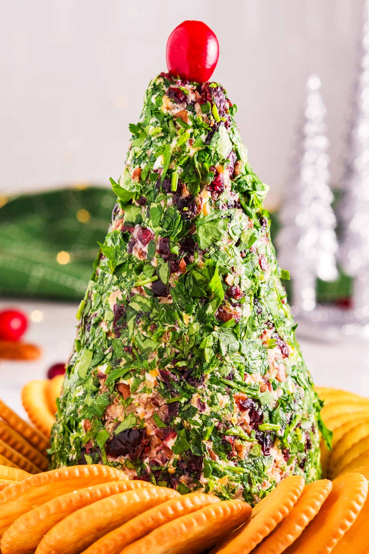 christmas tree shaped cheeseball in middle of crackers