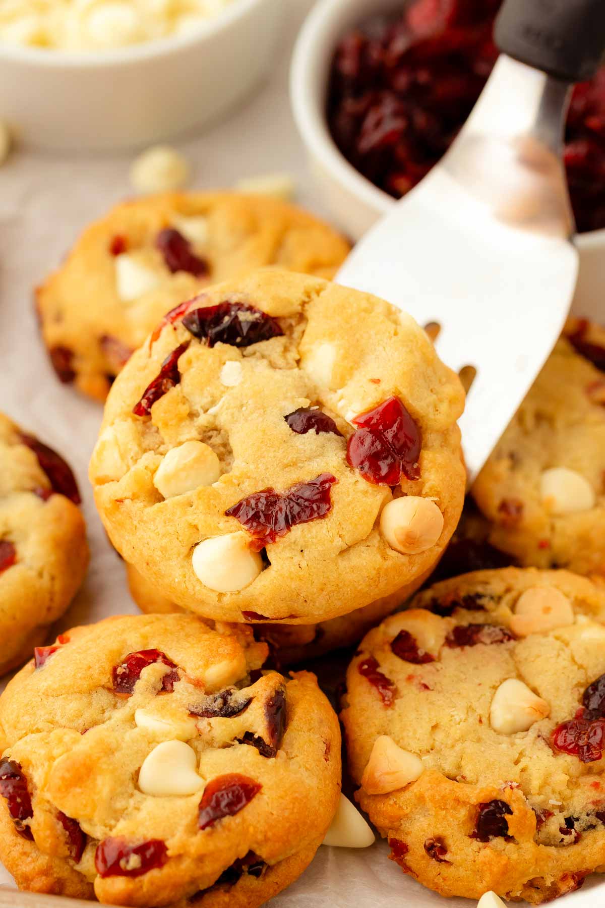 frontal view of cranberry white chocolate chip cookie on spatula